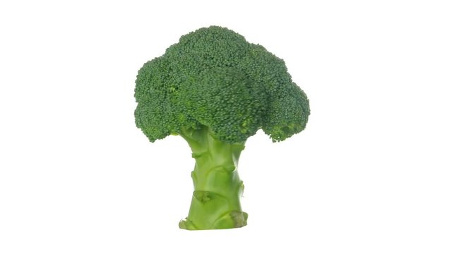 Rotating broccoli isolated on white background
