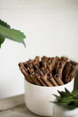 A bundle of cinnamon placed in a holder for an aromatherapy and decoration