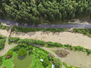 Fototapeta na wymiar small river after flood or storm. Aerial view, Romania