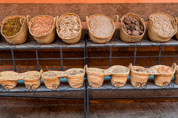 Baskets full of dried spices in moroccan open market