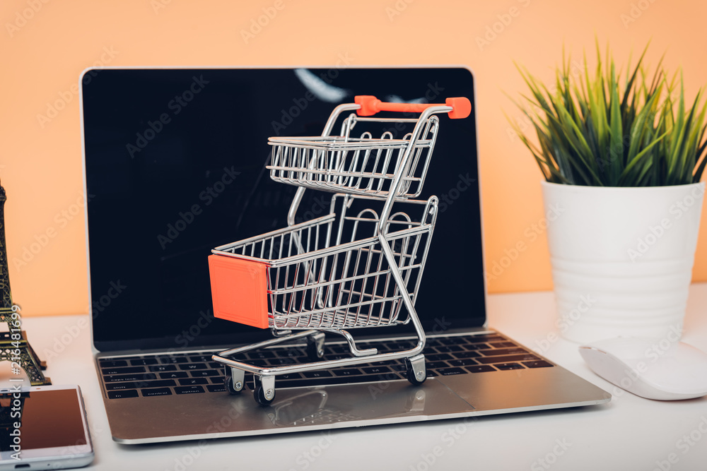 Poster mock up laptop notebook computer and shoppong online cart
