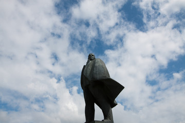 Monument of Vladimir Lenin against the blue sky