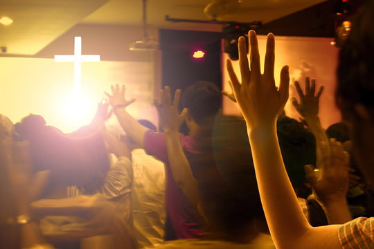 Praise And Worship Concept:Hands Raised In Excitement And Praise At Contemporary Church Concert And Bright Lights