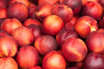 Fototapeta na wymiar closeup of nectarines peaches at the market