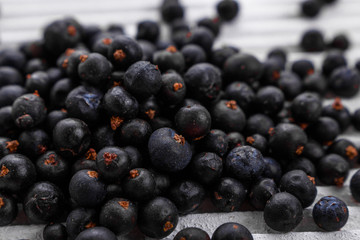 dried juniper berries on a white background