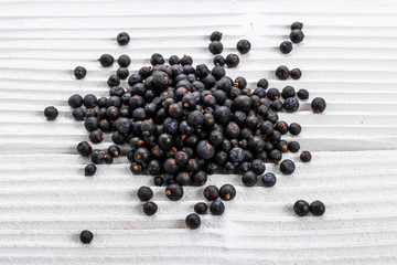 dried juniper berries on a white background