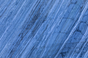 The background or texture of the marble wall of the quarry or opencast. The surface of the marble...