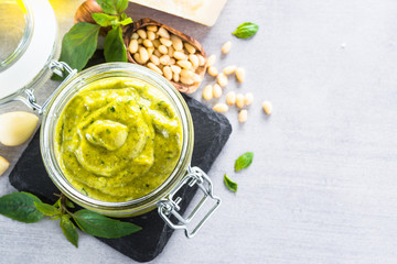 Pesto sauce in glass jar. 