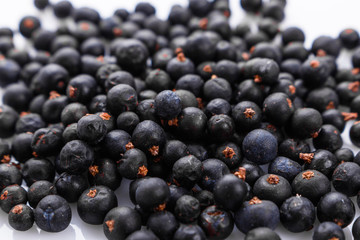 dried juniper berries on a white background