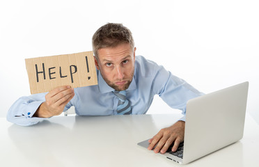 Businessman on laptop and help sign