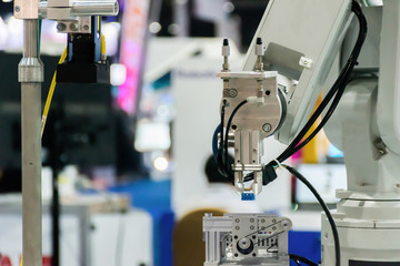 Robot Industrial 4.0 of things technology robot arm and man using controller for control