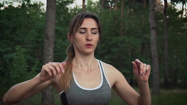 Breath of young woman doing sports in forest in slow motion
