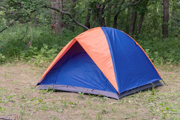 Tourist tent on the background of forest