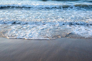 beautiful view of waves hits beach during sunset. soft focus  due to slow shutter. 
