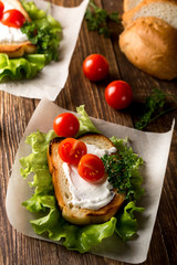Homemade Burger with tomatoes and lettuce. Fast food.
