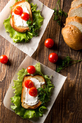 Homemade Burger with tomatoes and lettuce. Fast food.