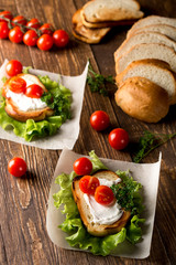 Homemade Burger with tomatoes and lettuce. Fast food.