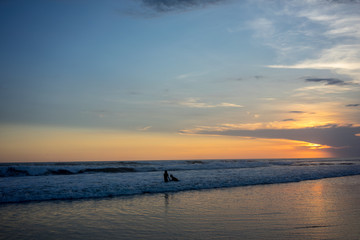Fototapeta premium couple on beach at sunset, romantic mood
