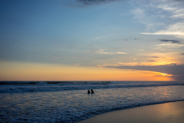 couple on beach at sunset, romantic mood