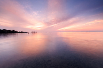 sunrise Seascape with beautiful reflection for background. soft focus due to long expose.