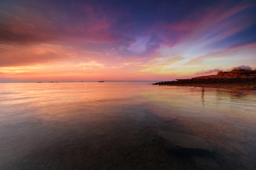 sunrise Seascape with beautiful reflection for background. soft focus due to long expose.