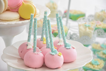 Sweet table for child birthday. Candy bar with a lot of different candies and sweet cakes