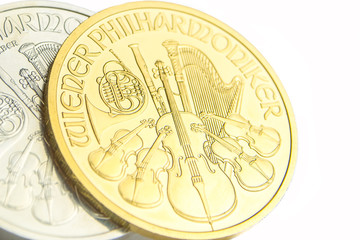 silver and golden austrian philharmoniker one ounce coins