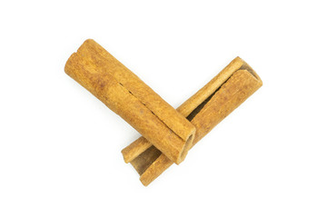 Group of two whole dry brown cinnamon stick flatlay isolated on white background