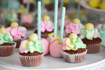 Sweet table for child birthday. Candy bar with a lot of different candies and sweet cakes