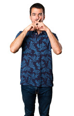 Brunette man making silence gesture on white background