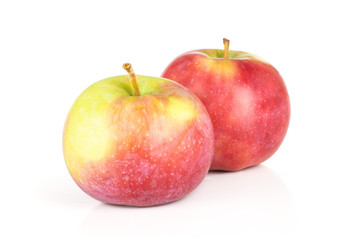Group of two whole fresh red apple james grieve variety isolated on white background