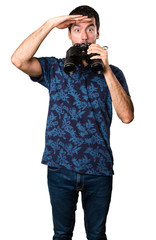 Brunette man with binoculars on white background