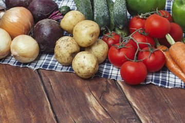 Fresh organic farm vegetables, Health care, on a wooden backgrou