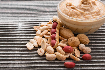 peanut paste on a wooden rustic background