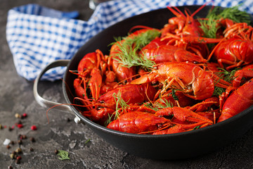 Crayfish. Red boiled crawfishes on table in rustic style, closeup. Lobster closeup. Border design