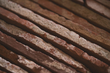 closeup stacked old brick cut tiles