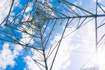 High voltage post or High voltage tower with blue sky background.