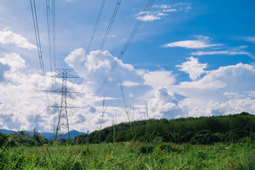 High voltage post or High voltage tower with blue sky background.