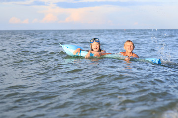 Two children in the sea
