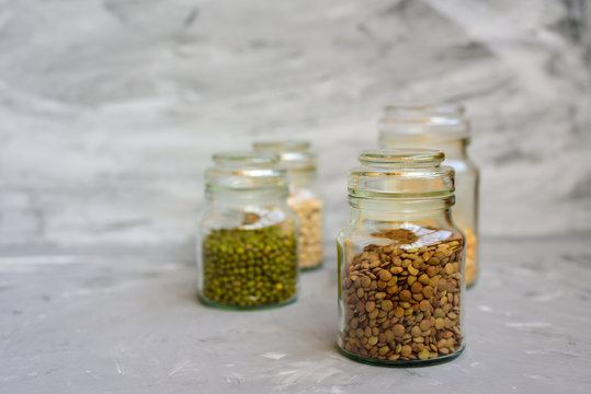 Variety of beans in glass jars