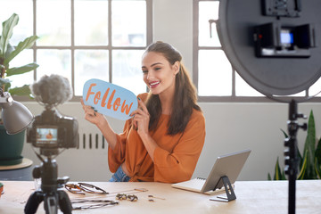Vlogger telling viewers to follow her channel