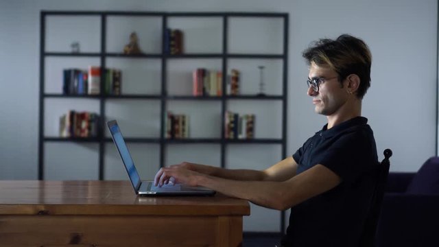 System Administrator looking for Updates, Using Laptop, Working in Coworking Place, Making Digital Analysis