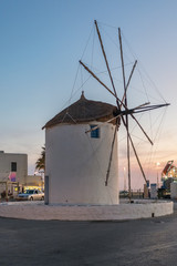 Traditional cycladic windmill at sunset on Paros island, Cyclades, Greece