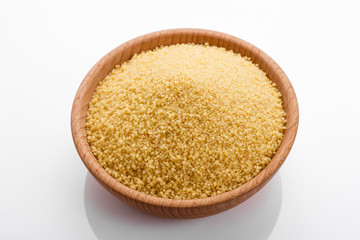 fresh couscous on a white acrylic background