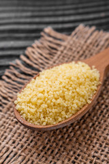 fresh couscous on a wooden rustic background