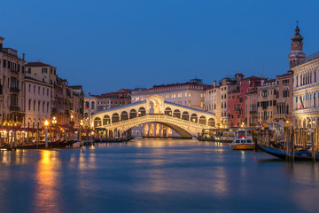 Rialto bridge and Grand Canal at night in Venice, Italy