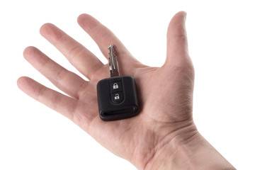 Hand holding car alarm, isolated on white background