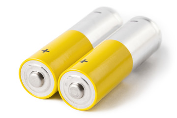 Close-up of two AA batteries, isolated on white background