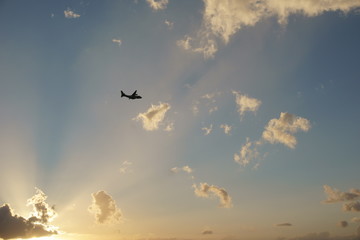 View of a plane gliding in blue sky