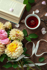 Naklejka na ściany i meble Summer theme tea with freshly picked flower bouquet: dahlias and roses on wooden table. Rustic style